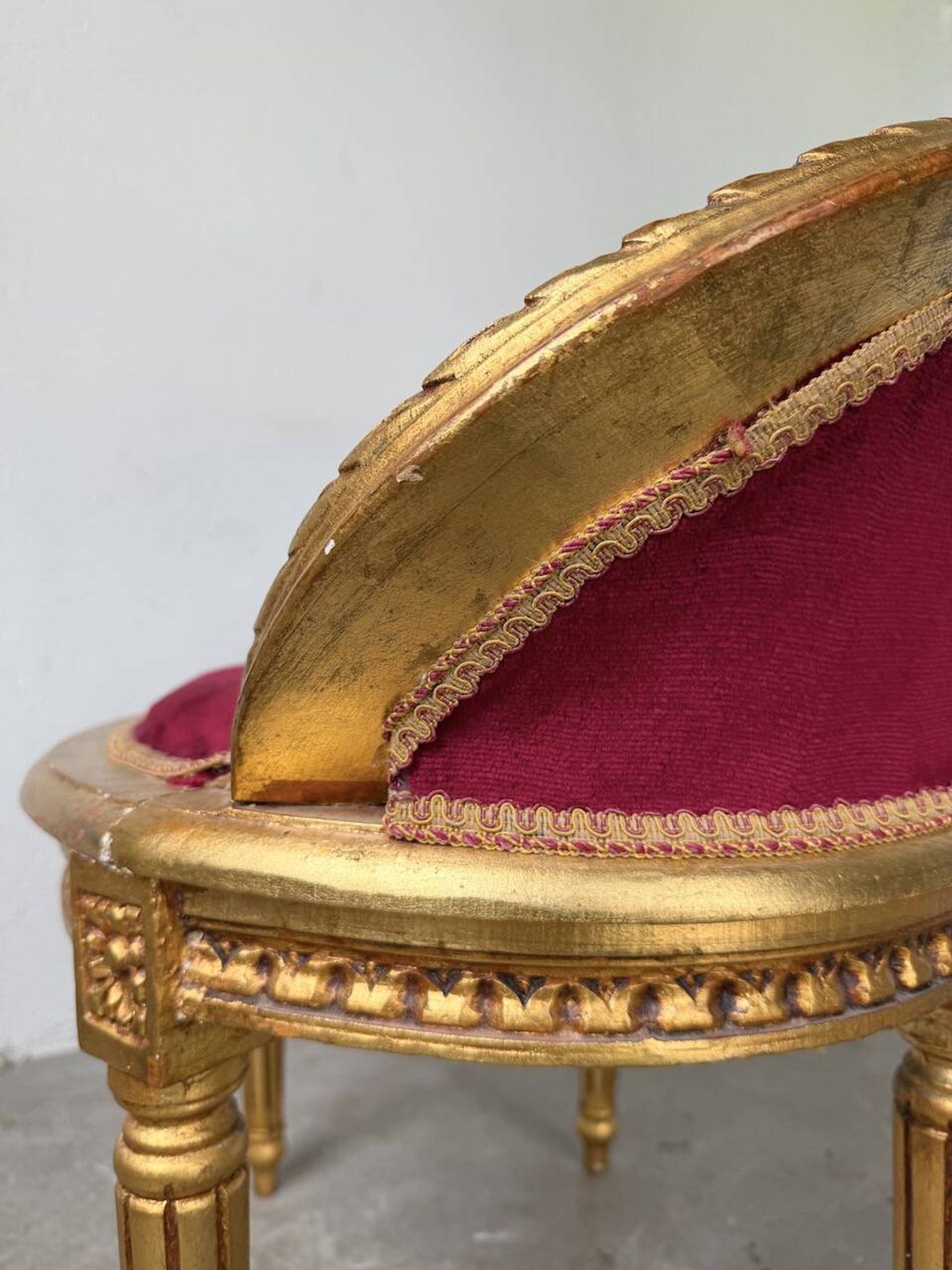 Louis XVI gilt wood and red velvet armchair