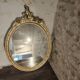 Oval gold mirror