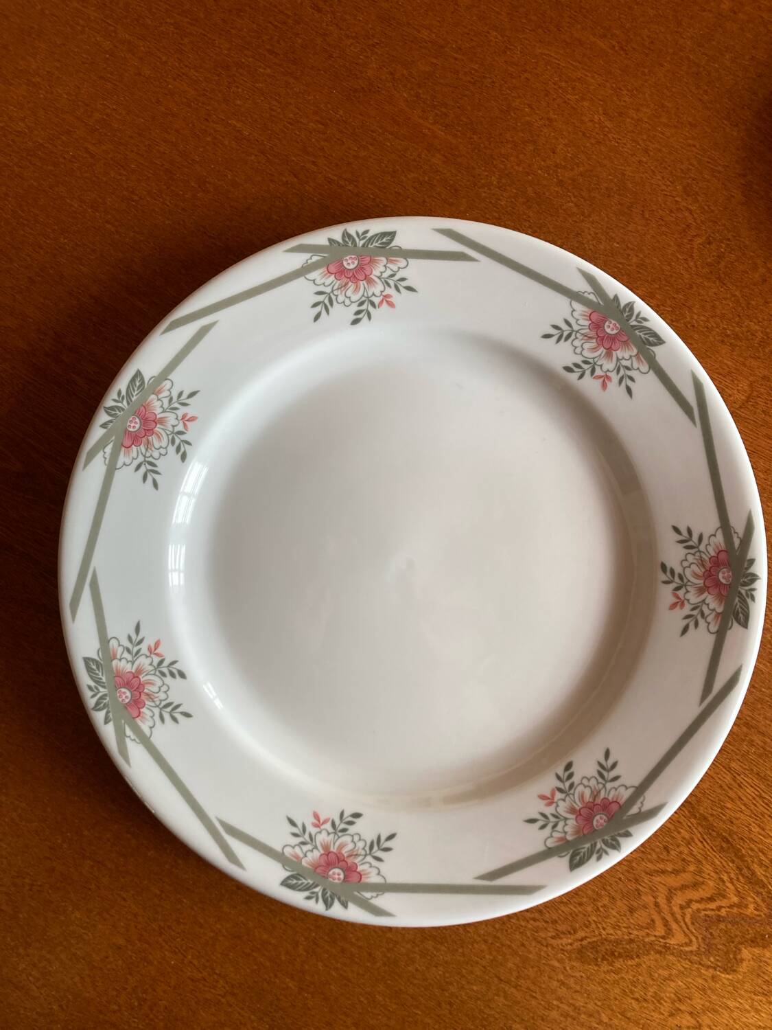 Round Limoges Bernardaud porcelain dish with floral frieze and sticks