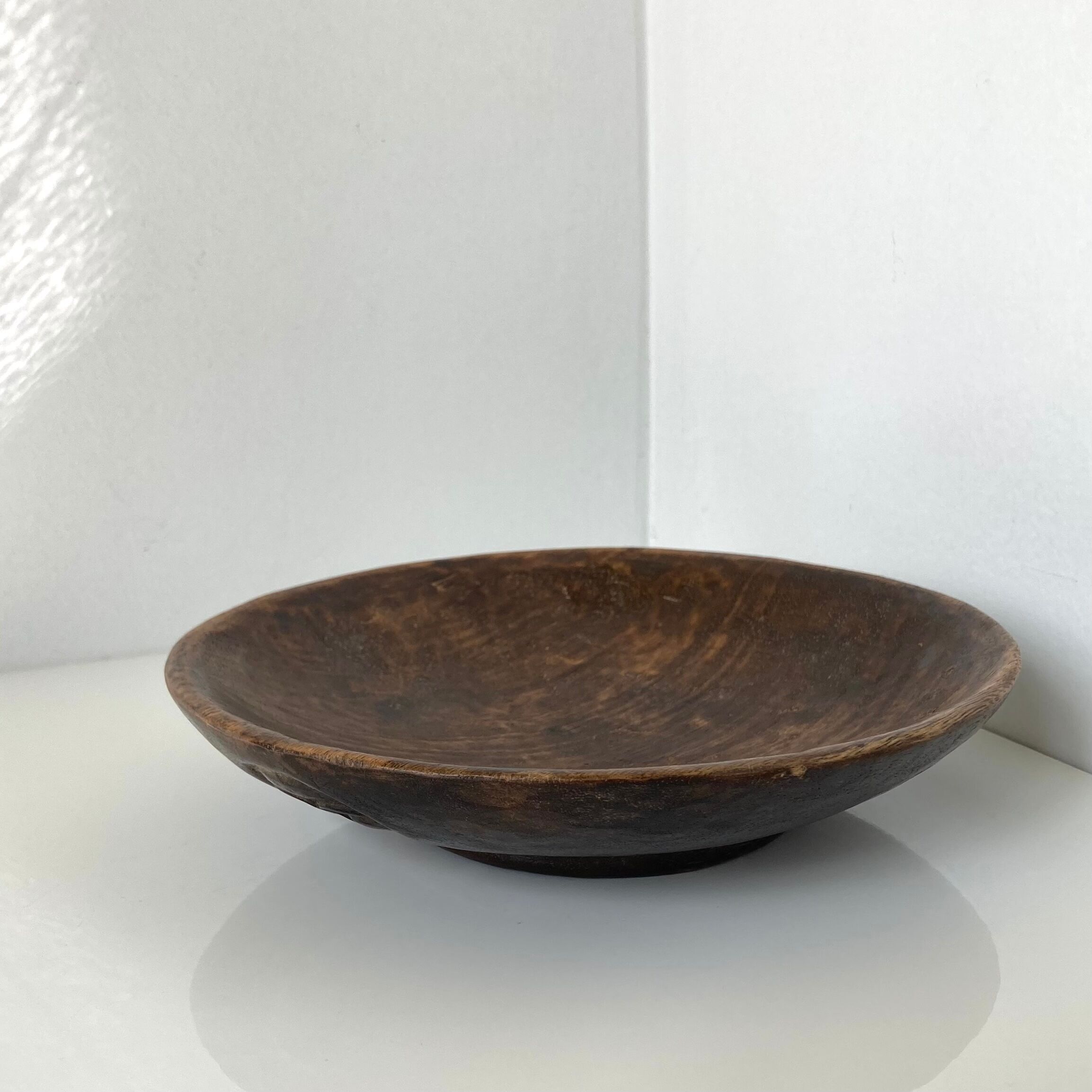 Vintage African tidy in natural wood with carved decoration in flat masks