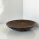 Vintage African tidy in natural wood with carved decoration in flat masks