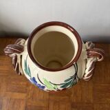 Ceramic vase with hand-painted floral decoration.