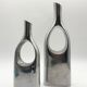 Pair of "drop" vases in aluminium cast, Italy, 1970s