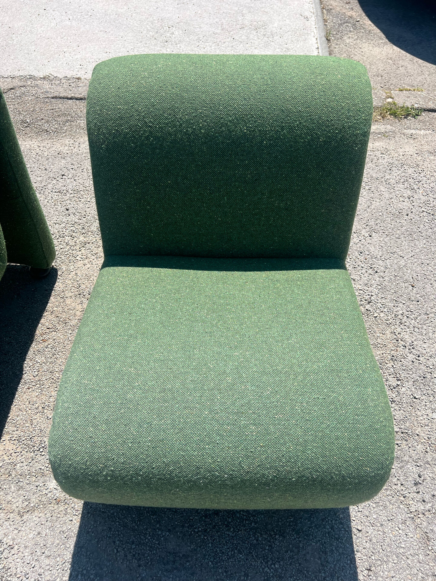 Green armchairs designed by Étienne Fermigier