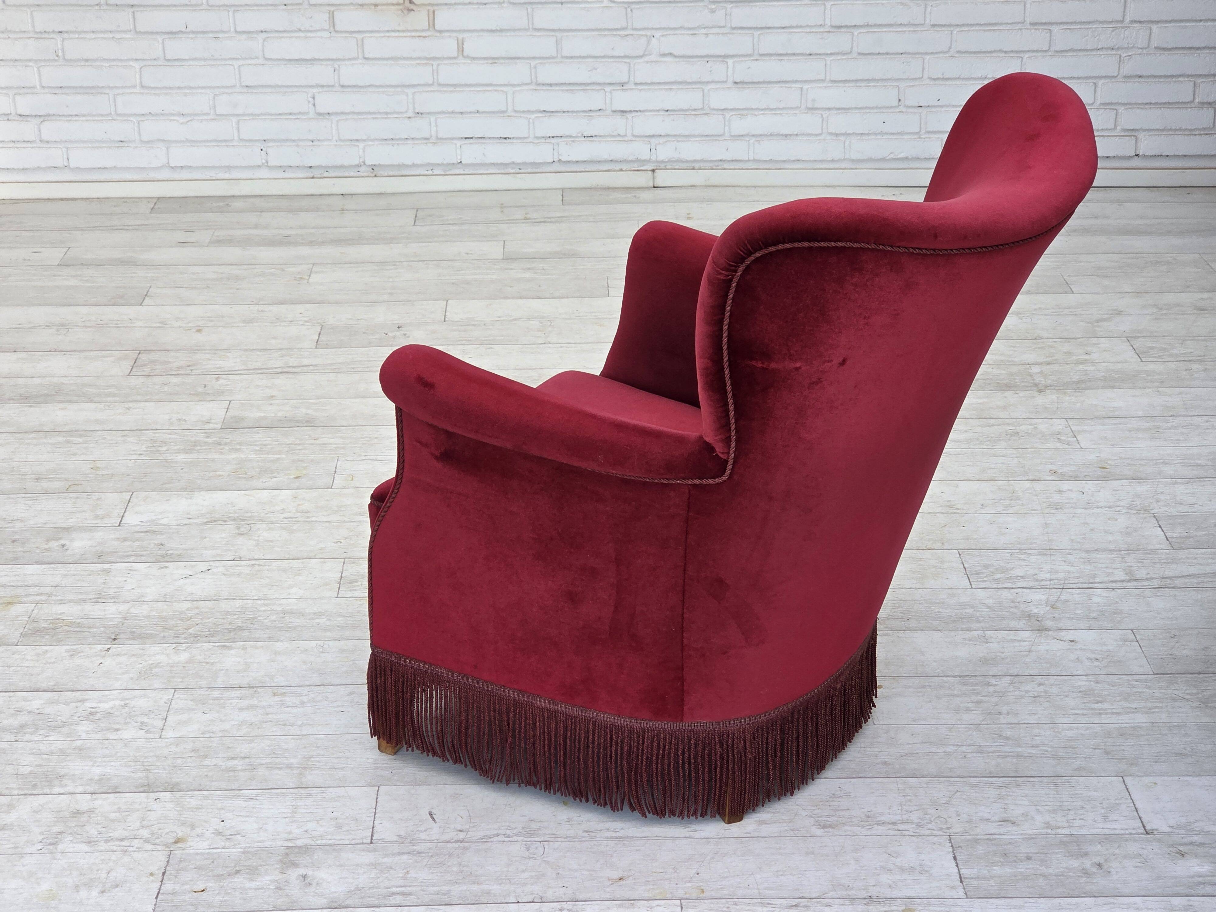 1970s, Danish armchair, cherry-red furniture velour, oak wood legs.