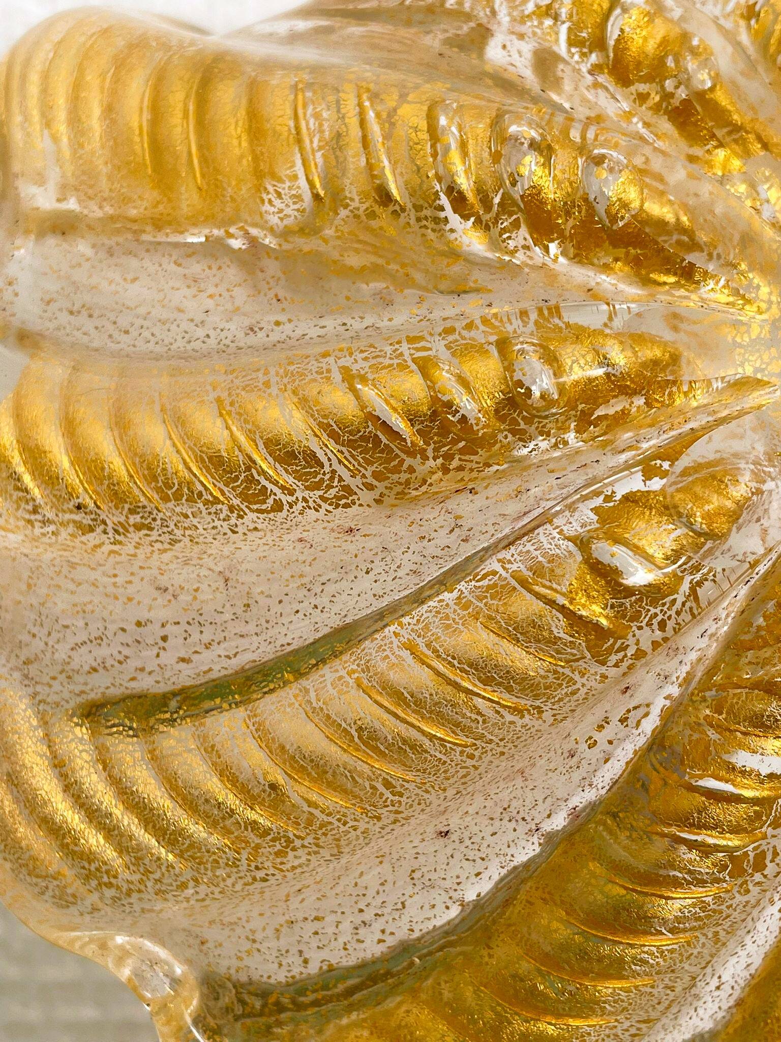 Murano glass scallop bowl in Italy with gold glitter trim