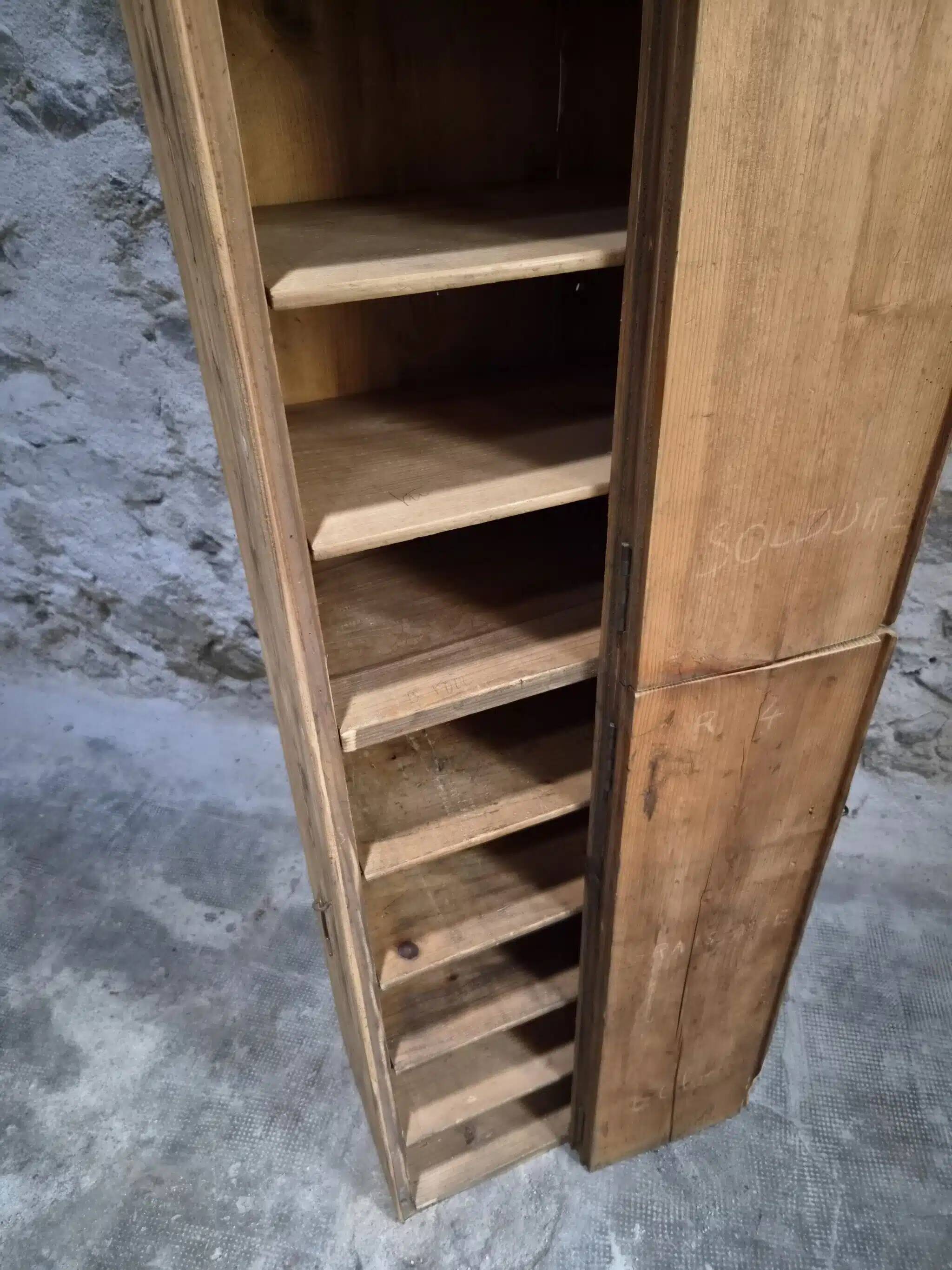 Antique French workshop cabinet in pine with compartments.