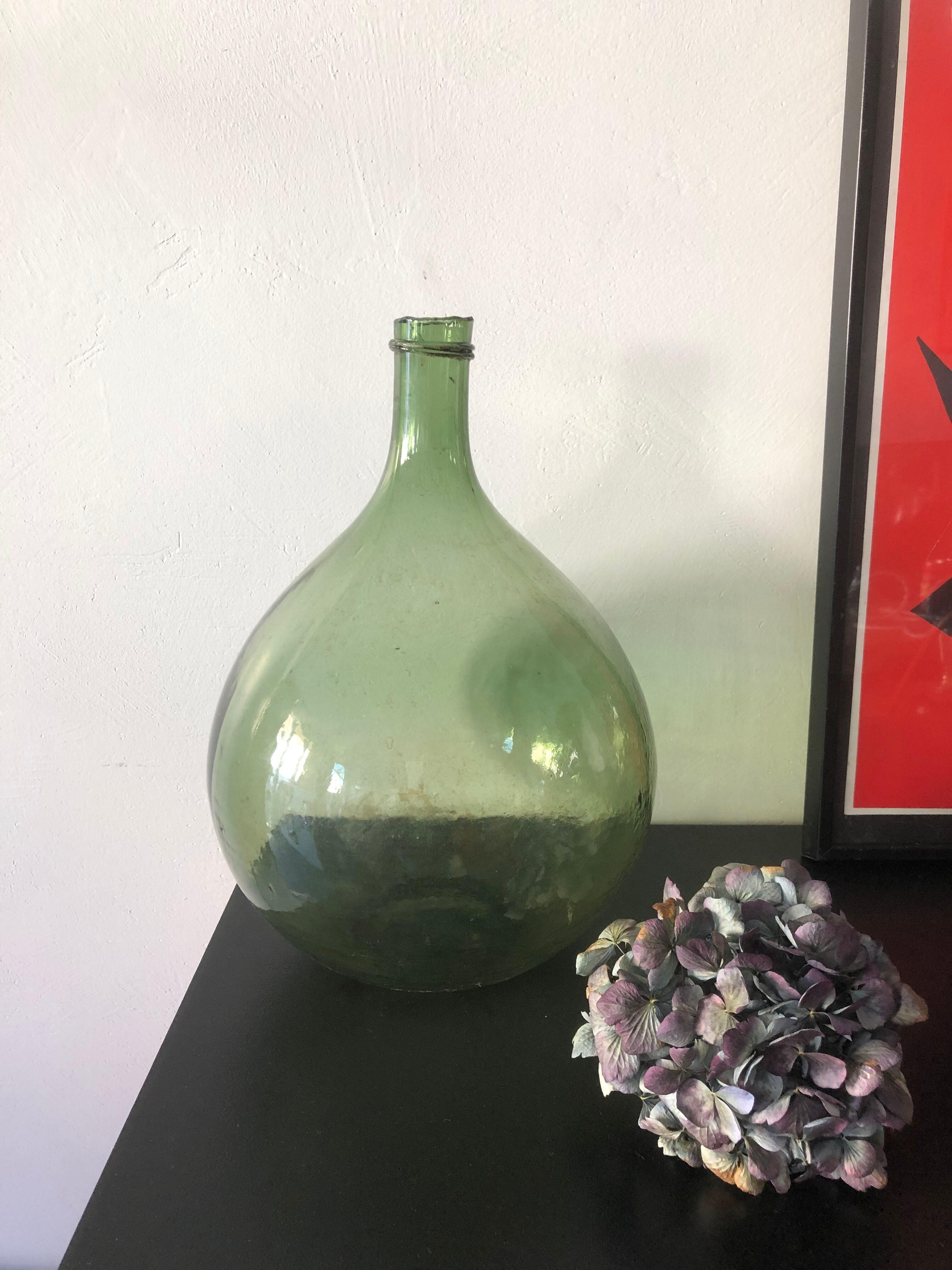 Demijohn old bottle in blown glass