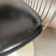 A striking set of four vintage swivel dining chairs