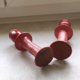 A pair of glazed earthenware candlesticks.