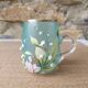 Enamelled glass mug/cup