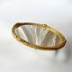 Antique oval wall mirror in gold resin - 63 cm