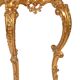 Console with a gilded wooden mirror.