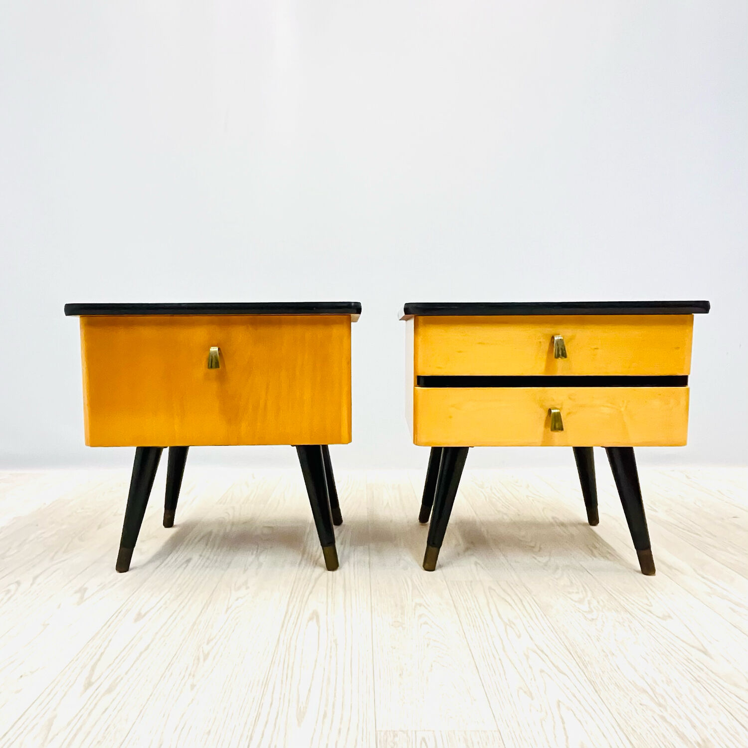 A pair of night cabinets