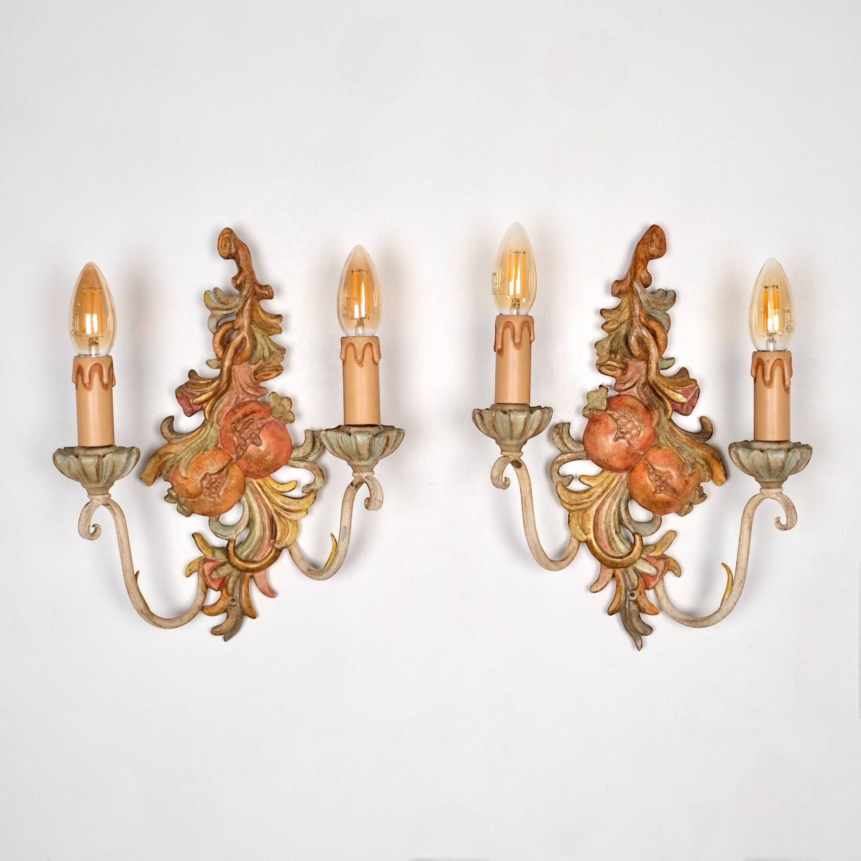 Pair of carved wood and metal sconces, Chelini FIrenze, Italy