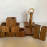 Six salt and pepper cherry-makers with their support