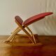 Vintage rocking footstool in red Skai and wood