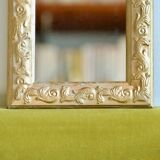 Antique gilded shell mirror with arabesque moldings