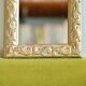 Antique gilded shell mirror with arabesque moldings