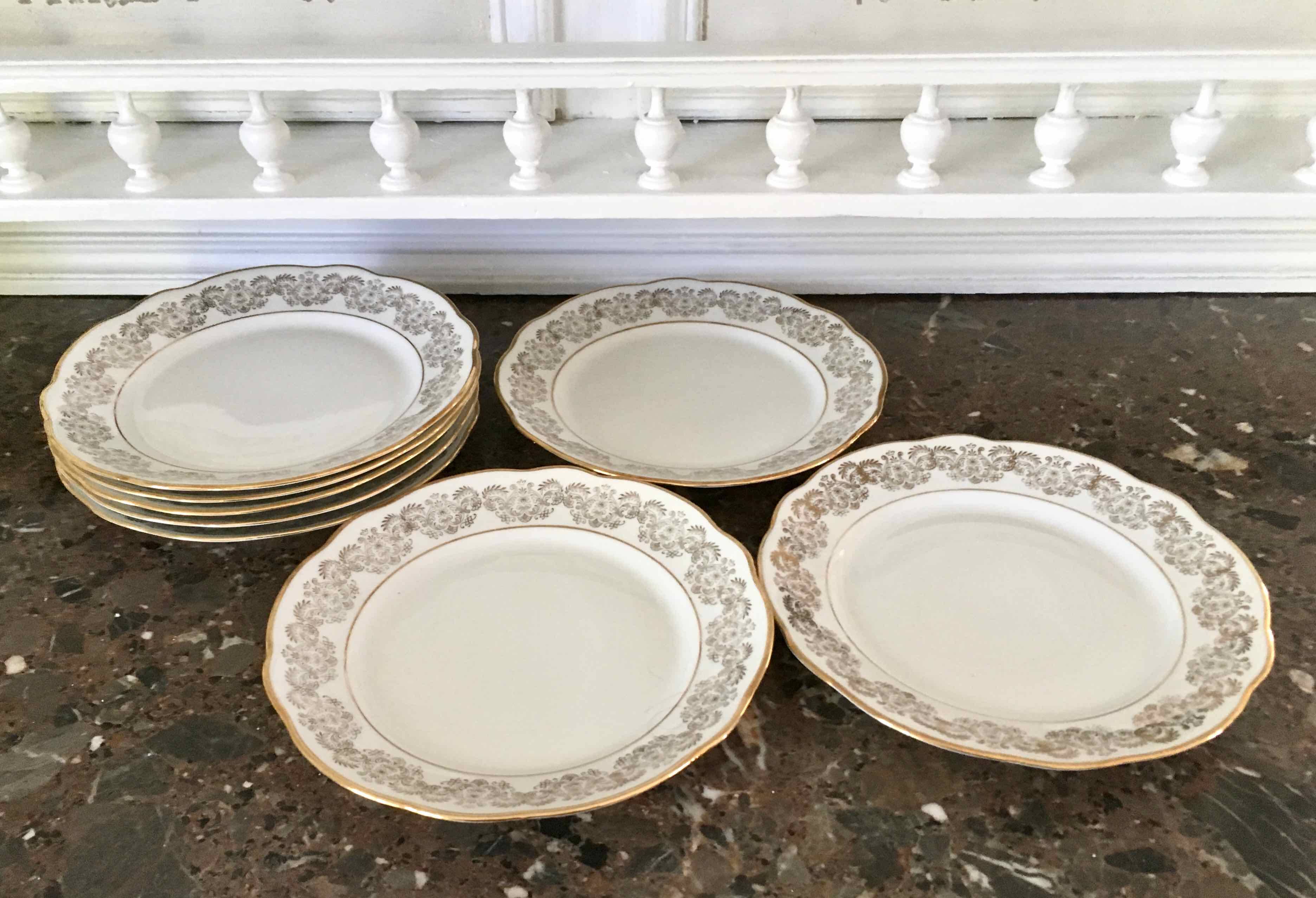 8 white and gold porcelain dessert plates