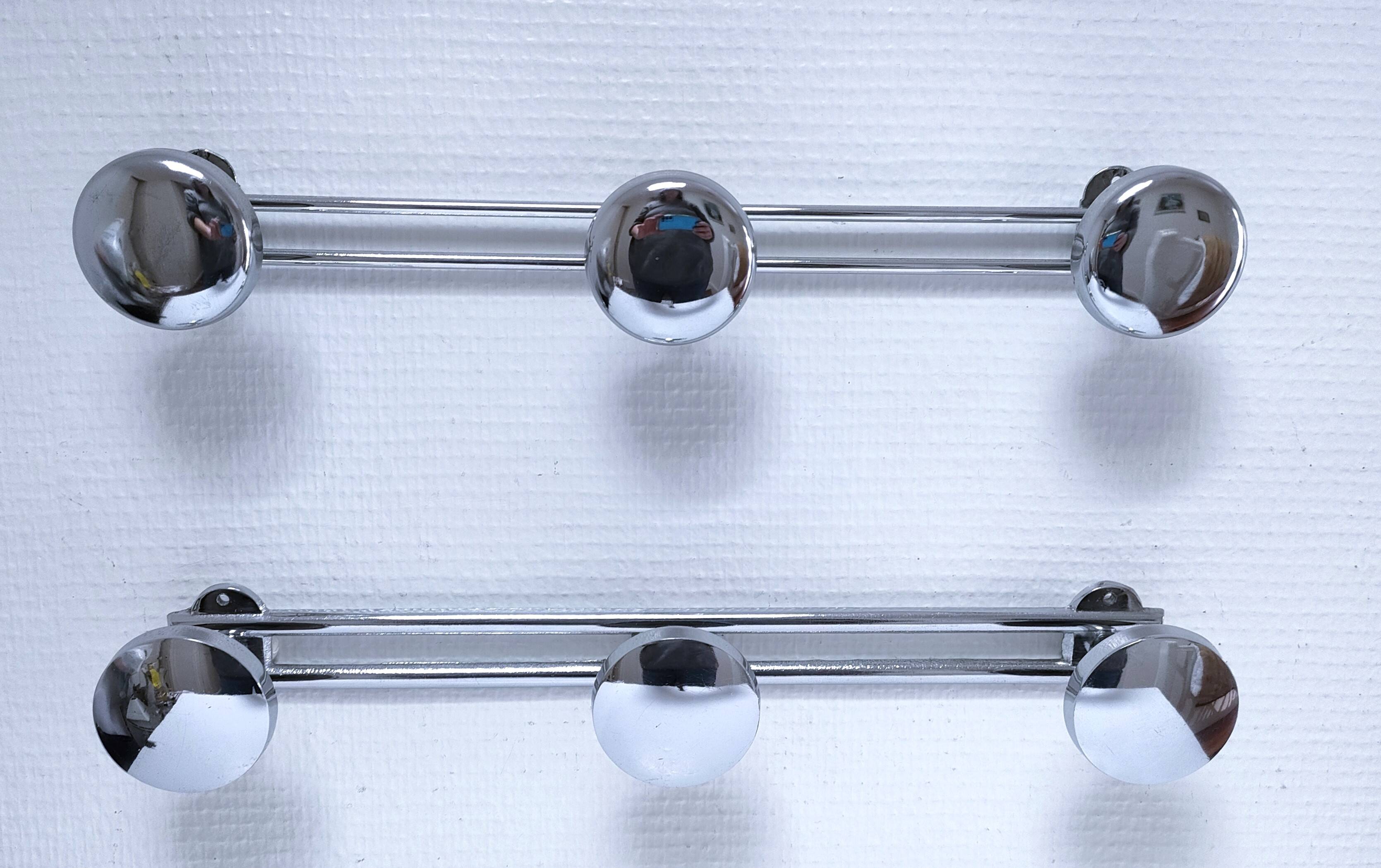 Two vintage chrome metal coat racks