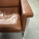 Fauteuil en cuir, années 1970, fabricant Sitag, cuir marron cognac.