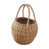 Round basket Wicker braided with two handles.