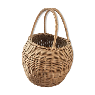 Round basket Wicker braided with two handles.