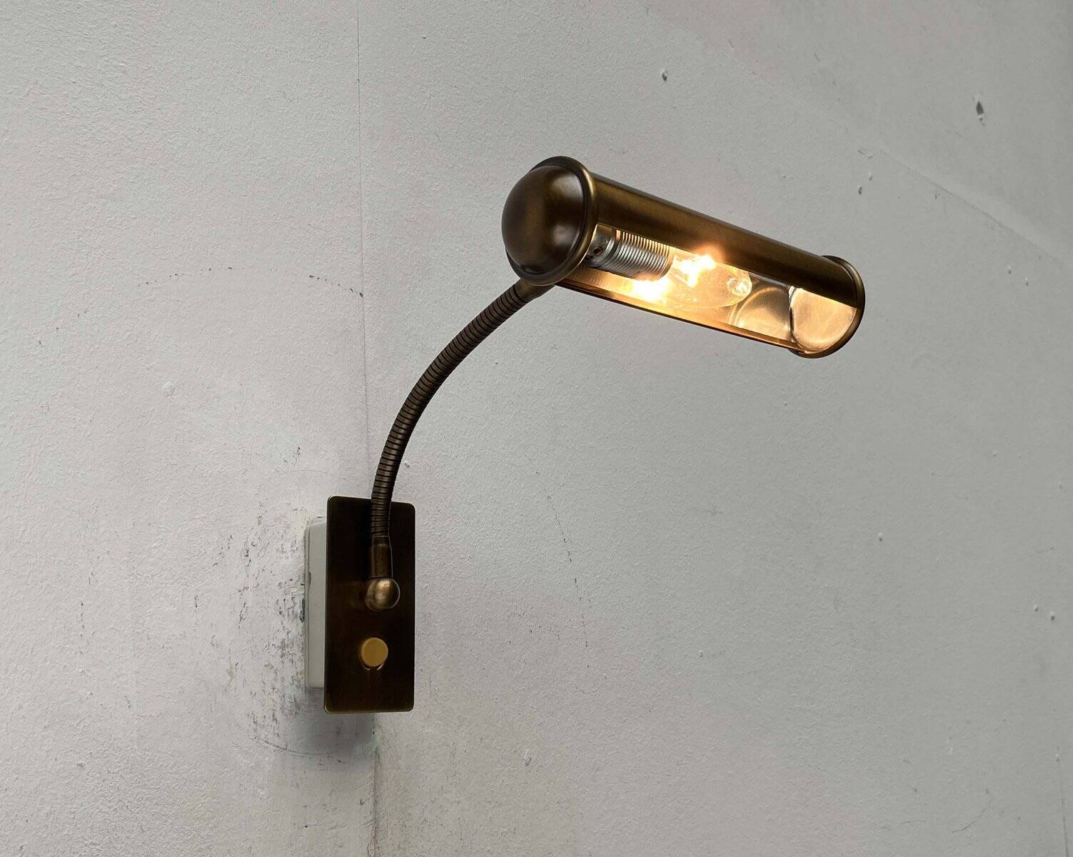 Vintage German brass patinated wall lamp with a gooseneck design by Honsel, 1970s.