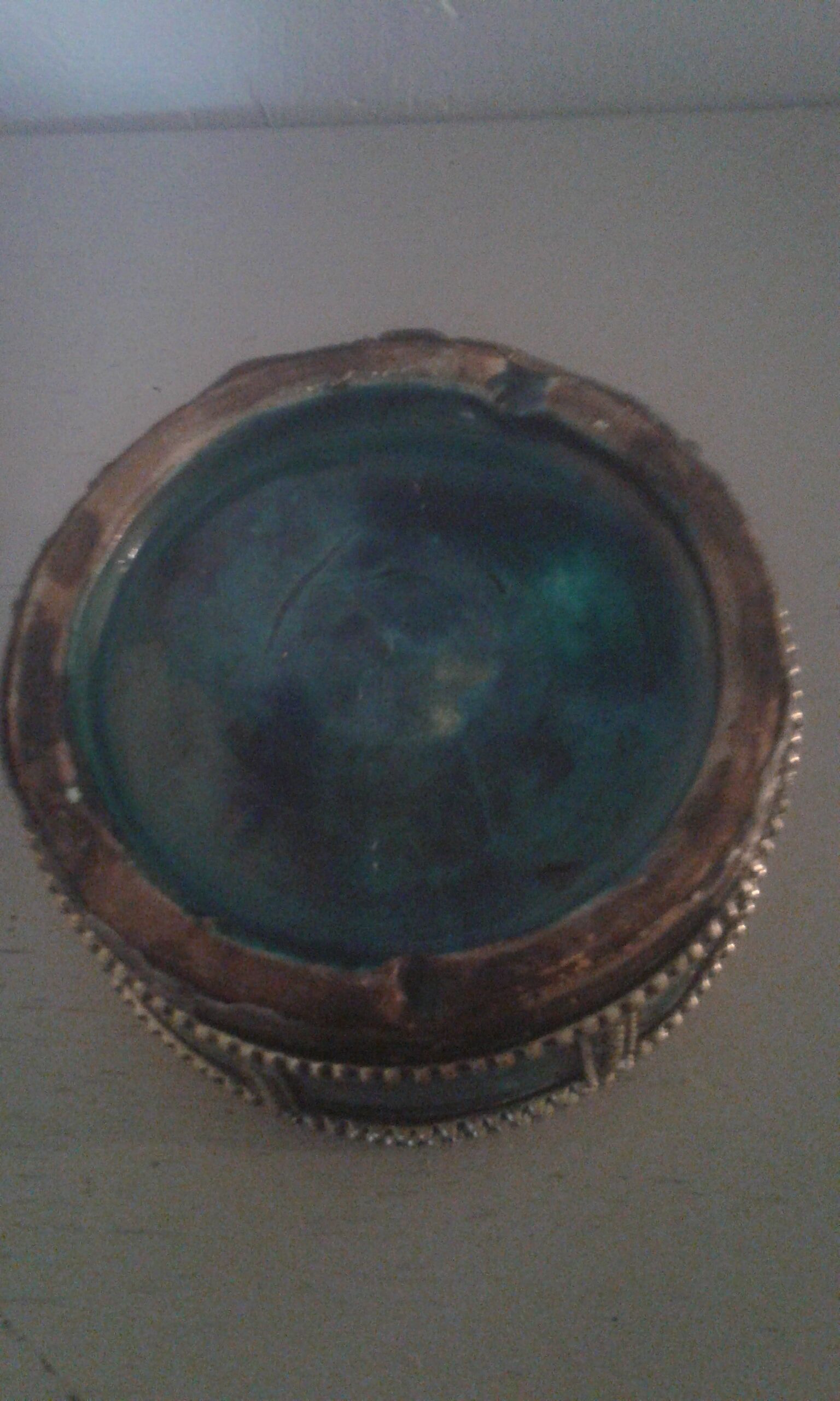 Ancient box in ceramic and enamel surrounded by brass