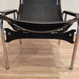 Pair of black leather reclining relaxation armchairs, "Hans Eichenberger" design, 19