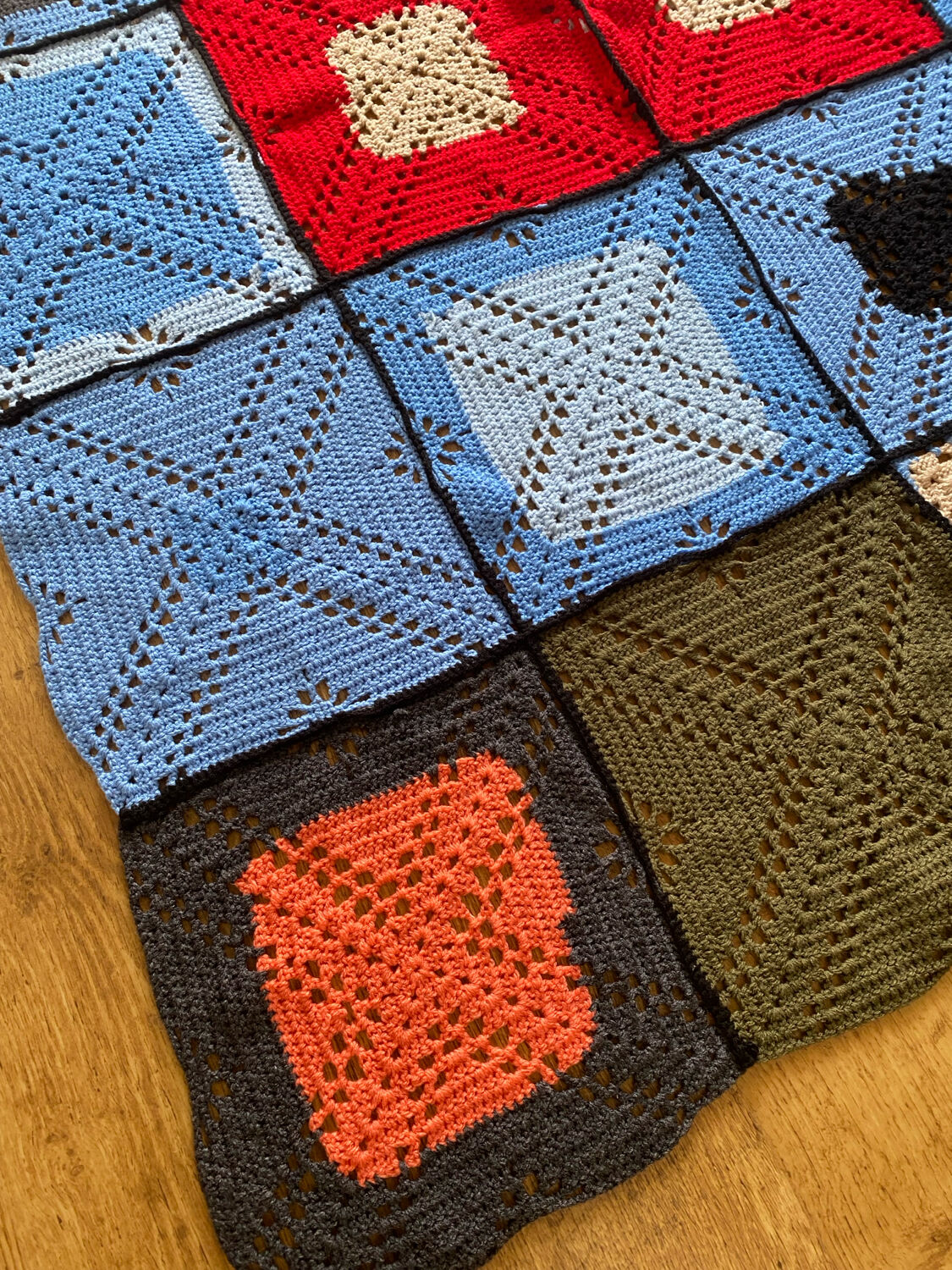 Hand-knitted patchwork blanket