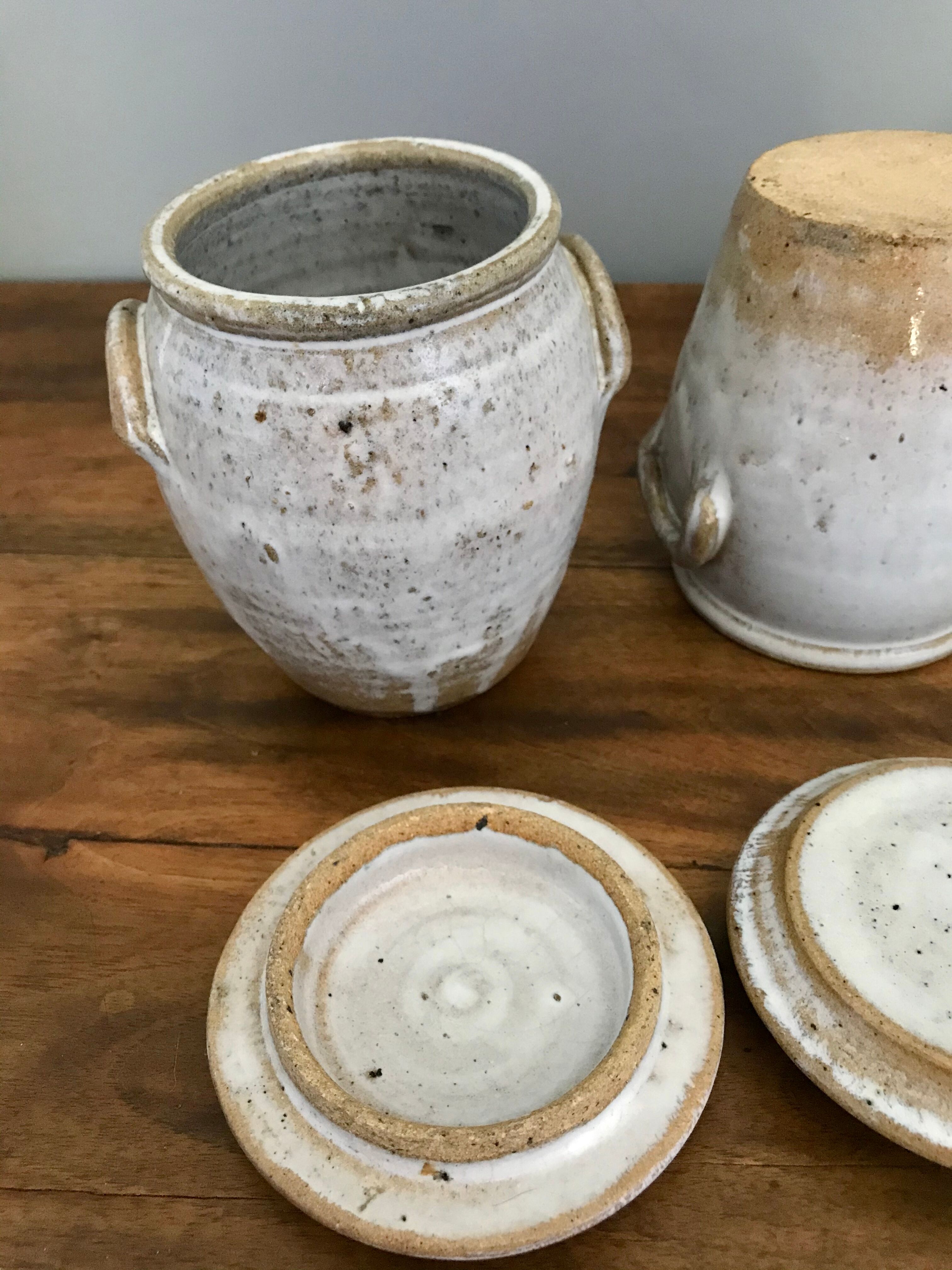 Suite of antique enamelled ceramic pots