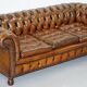 Restored vintage leather Chesterfield canapé in Thomas Chippendale style.