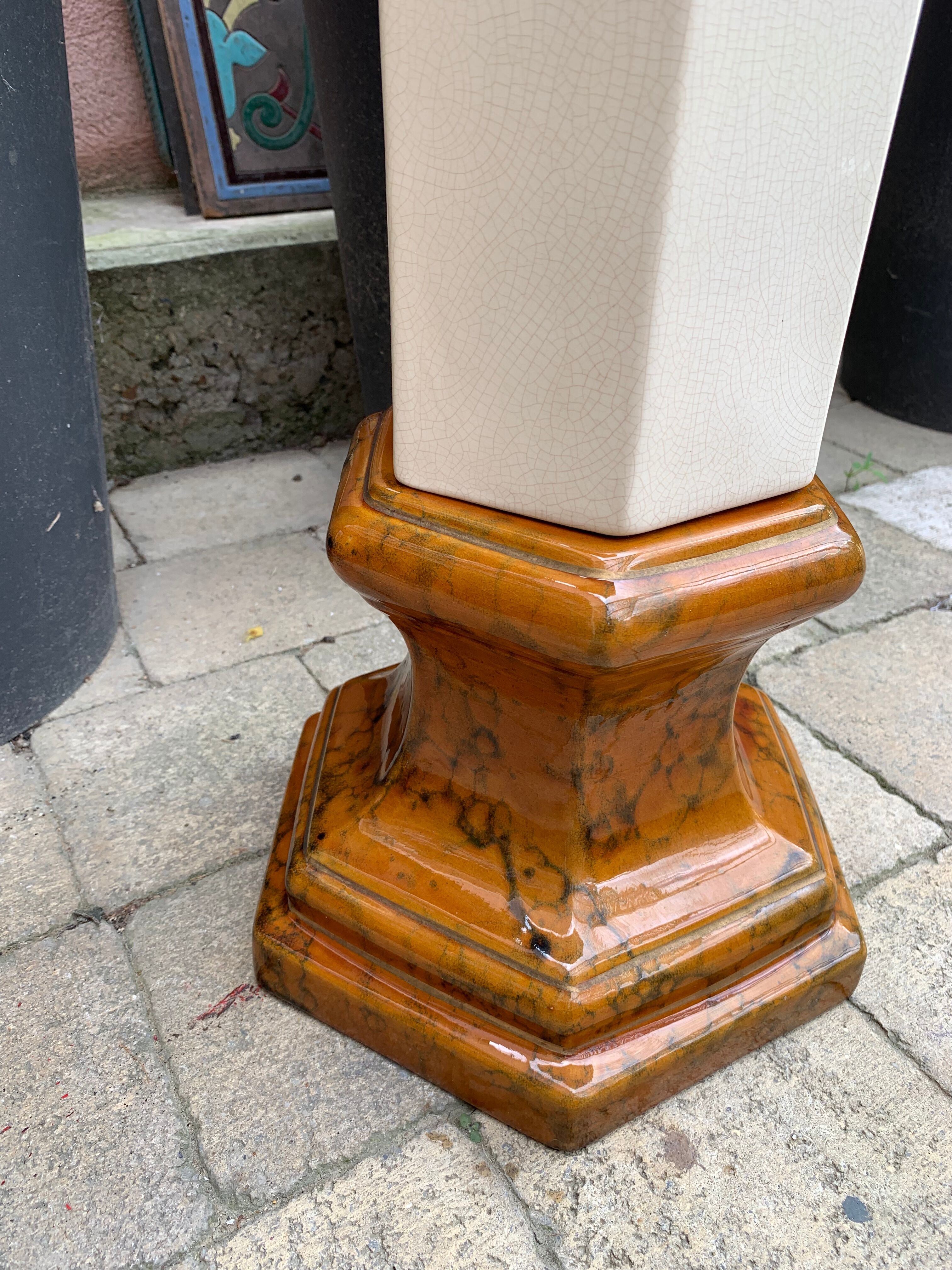 Column wears vintage plant