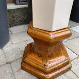 Column wears vintage plant