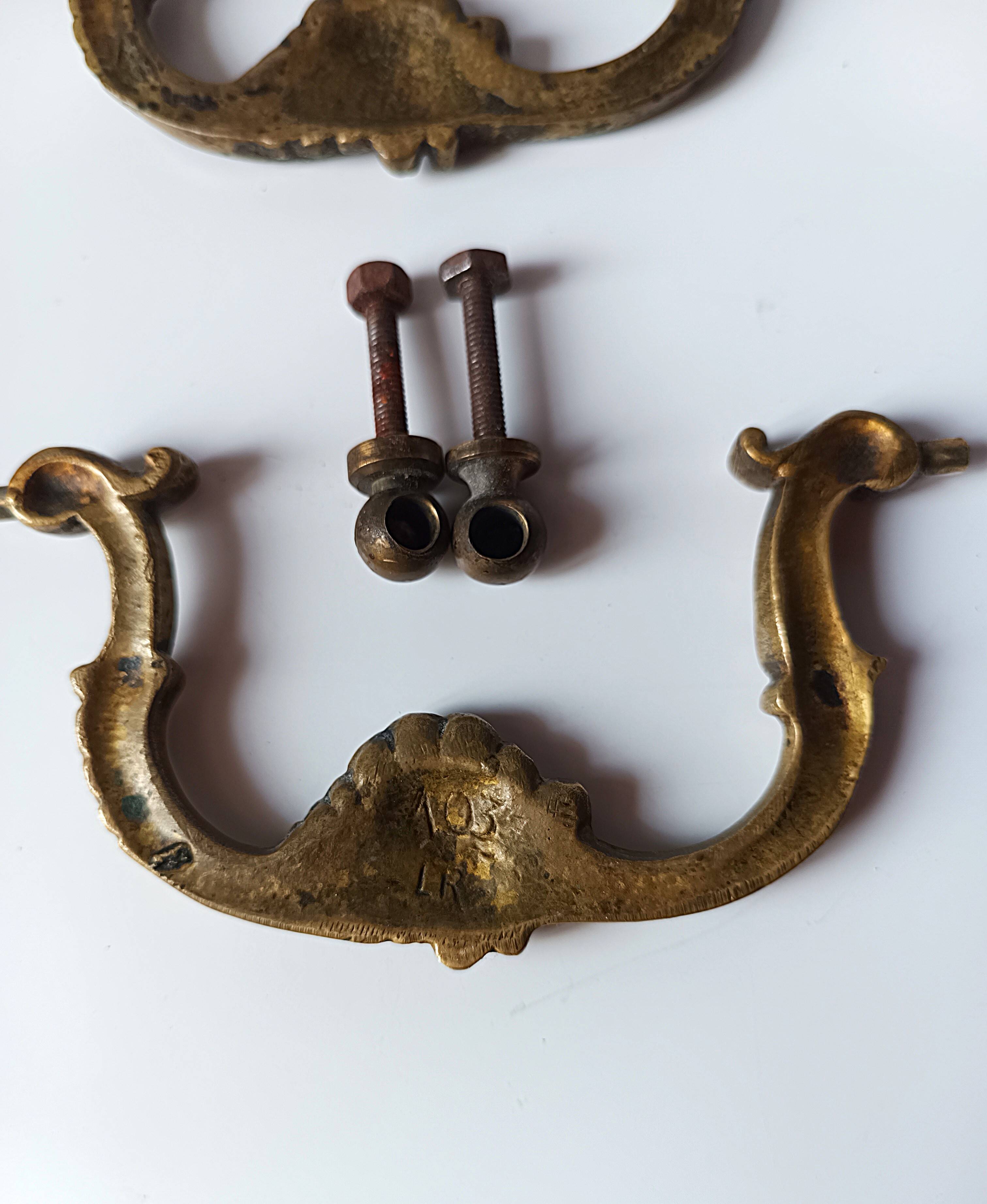 Antique pair of bronze drawer handles.