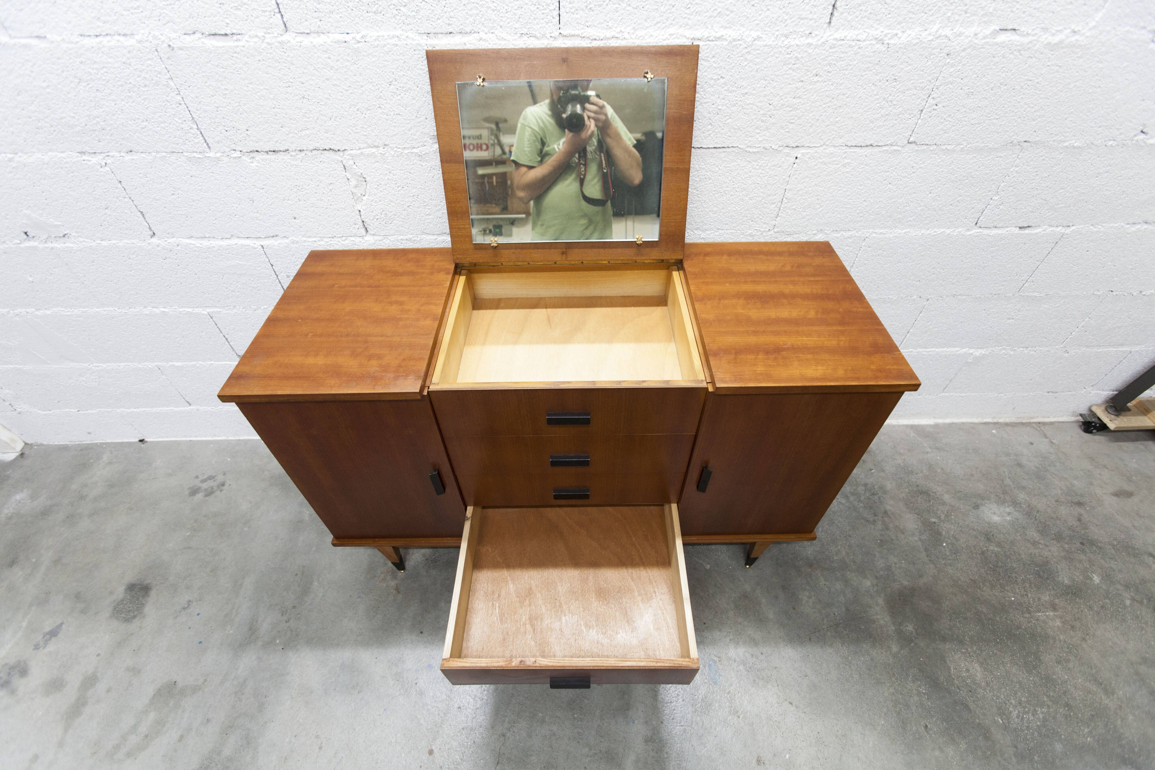 1960s teak sideboard with 4 drawers, 2 doors, and a mirror.