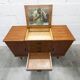 1960s teak sideboard with 4 drawers, 2 doors, and a mirror.