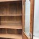 Walnut glazed bookcase with nineteenth century rose window