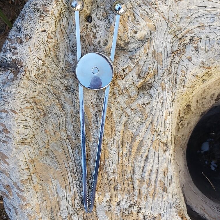 Modernist sugar pinch chrome metal