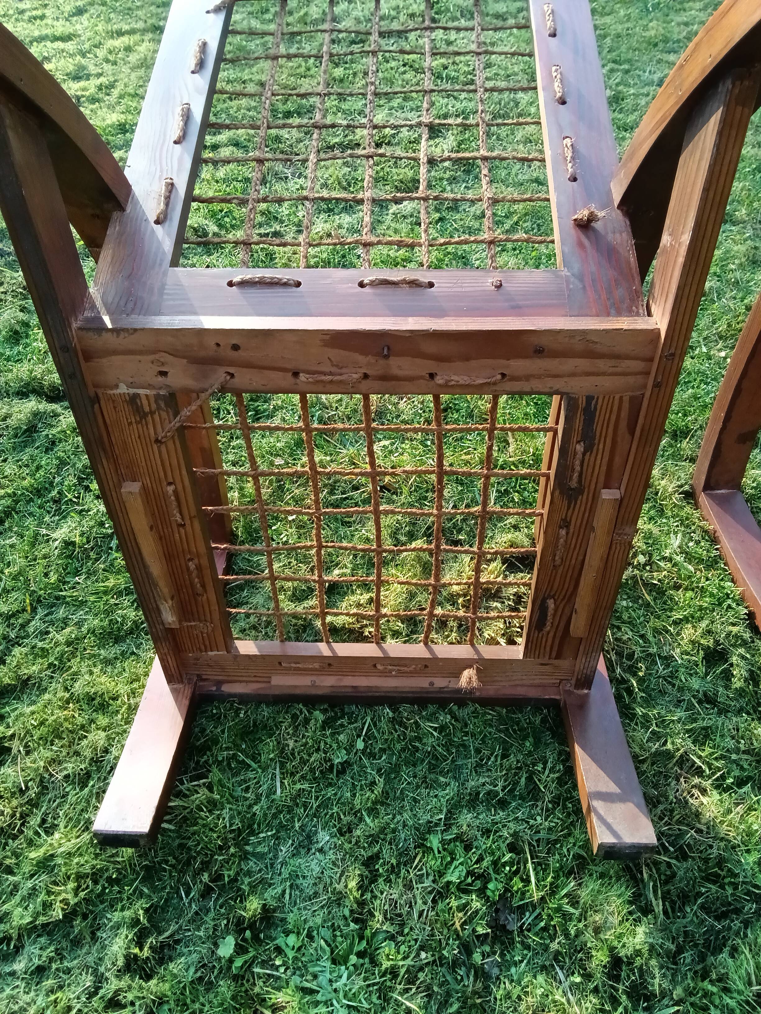 A pair of vintage rope and wood armchairs