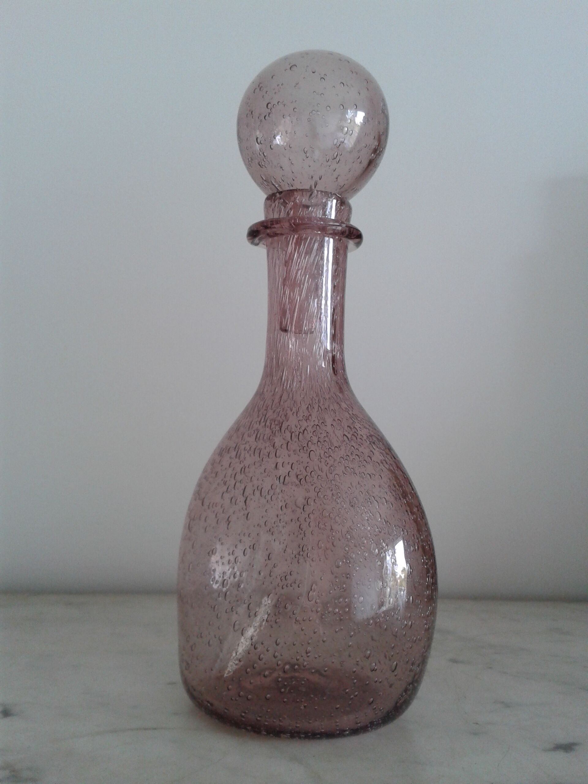 A bolted glass carafe