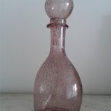 A bolted glass carafe
