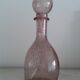 A bolted glass carafe