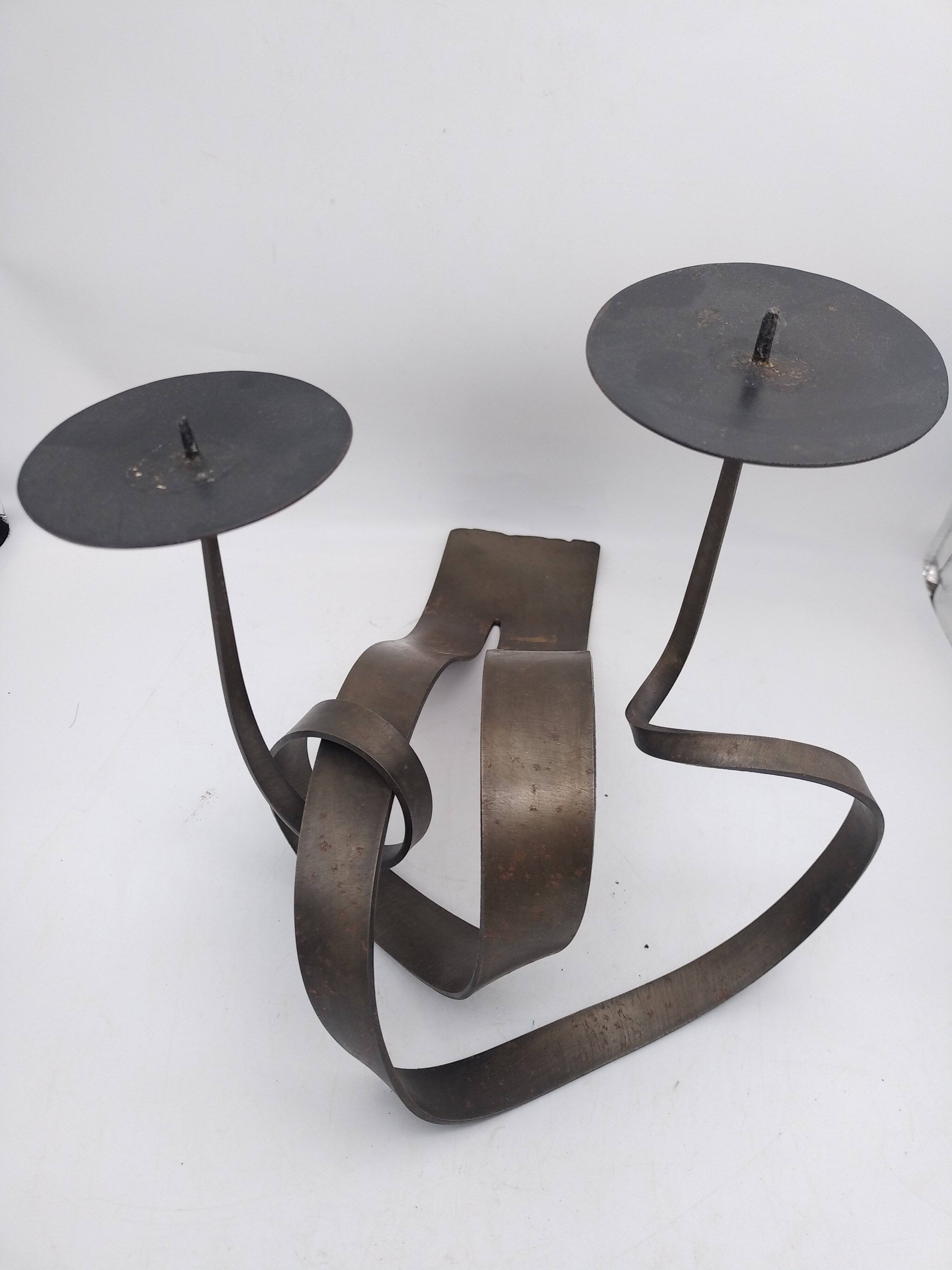 Brutalist candle holder in bronze effect metal.