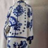 Pair of vintage Chinese blue and white porcelain figurines depicting