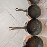 Set of 7 copper pans / brass handle