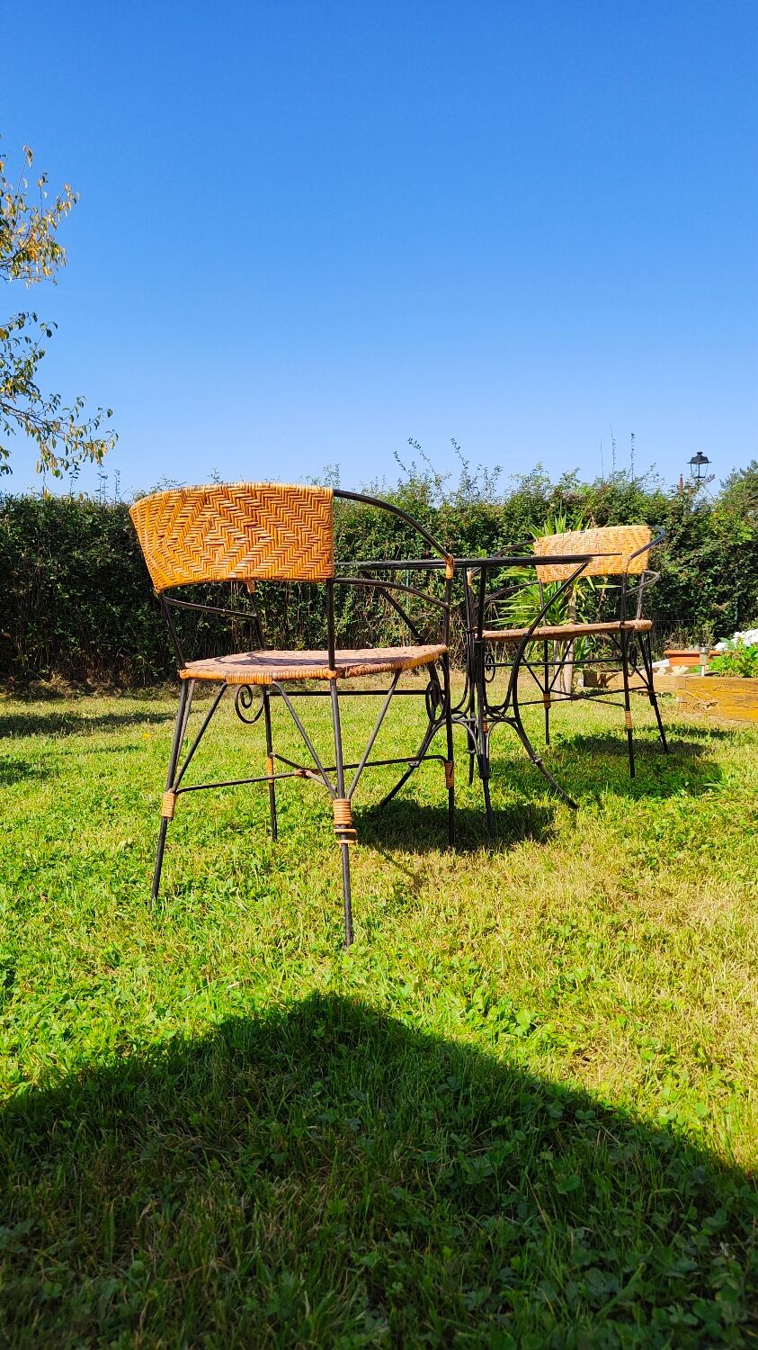 Garden table and wrought iron chair