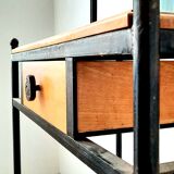 Brutalist hairdresser in wood and wrought iron